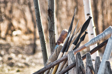Medievil Polearms near a fence against wood