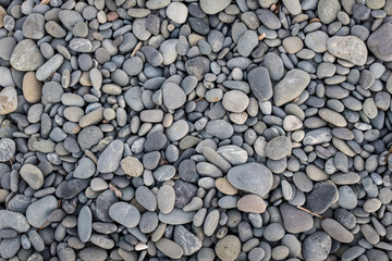 Grey beach pebbles pattern background