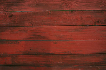 Background of red flaky wood Backdrop of red colored wooden panels with aged flaky surface