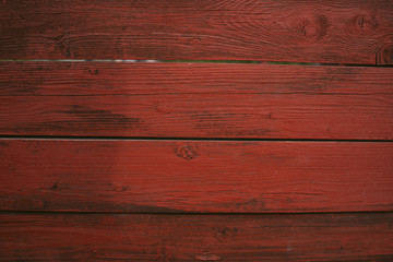 Background of red flaky wood Backdrop of red colored wooden panels with aged flaky surface