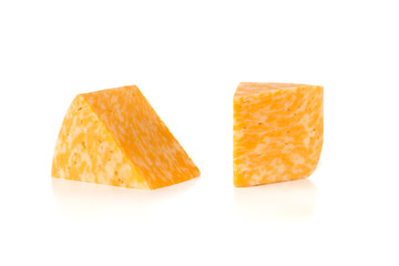 Marble cheese on a white background. Two triangles of cheese close up.