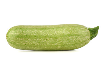 Zucchini on a white background. Green fresh zucchini closeup.