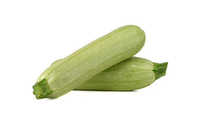 Courgettes on a white background. Green fresh zucchini close up.