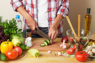 Woman cooks at the kitchen, body part, blurred background