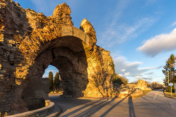 Sunset view of The South gate know as The Camels at roman fortifications in ancient city of...