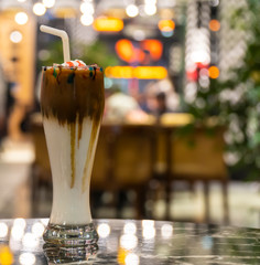 Chocolate Milk and Whipped Cream on Colorful Background