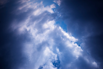 Naklejka na ściany i meble Dramatic glimpse among the clouds background hd