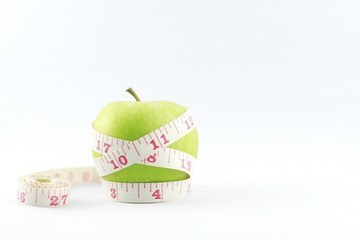 green apple and measure tape