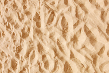 Sunny summer day beach sand pattern background.