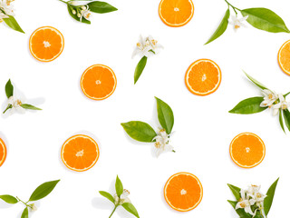 Oranges and flowers, flat lay.