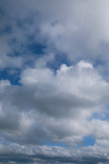 Obraz premium blue sky with grey and white clouds portrait orientation