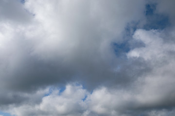 Fototapeta na wymiar Dramatic sky with white and grey clouds
