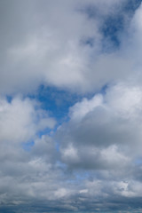 Obraz premium blue sky with white clouds to horizon portrait orientation