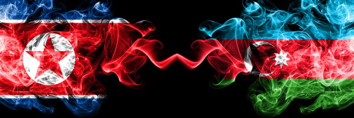 North Korea vs Azerbaijan, Azerbaijani smoky mystic flags placed side by side. Thick colored silky smoke flags of North Korea and Azerbaijan, Azerbaijani.