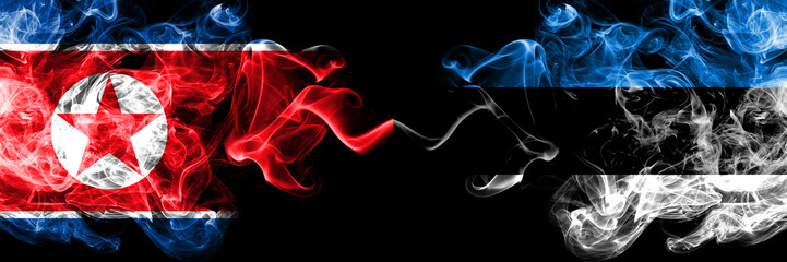 North Korea vs Estonia, Estonian smoky mystic flags placed side by side. Thick colored silky smoke flags of North Korea and Estonia, Estonian.