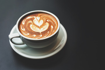 A cup of cappuccino with latte art.