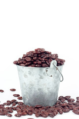 Red bean in metal bucket on white background.
