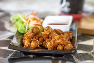 Blurred background of food (fried pork, fried chicken, french fries) served to customers and decorated with beautiful dishes for more appetizing