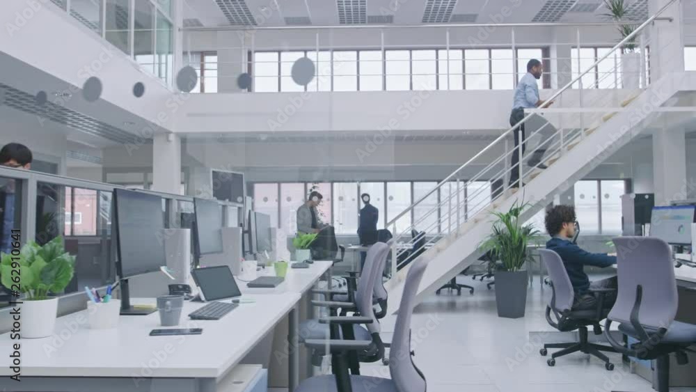 Poster in modern office: diverse team of managers and specialists work on computer, have discussion with co