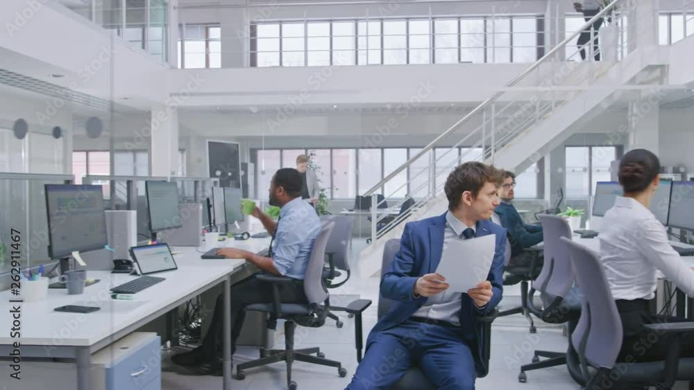 Poster in modern office: diverse team of managers and specialists work on computer, have discussion with co