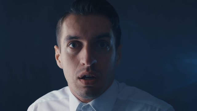 portrait of a frightened man saw something awful, he wants to escape in a panic