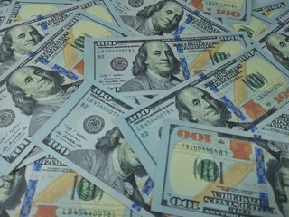 background of dollar banknotes and coins