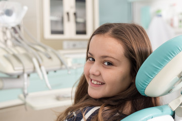 Girl in dentist office smiling