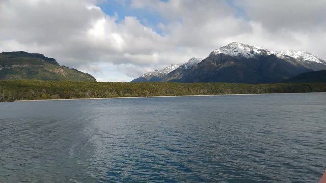 scene view of Menendez lake against snowcapped andes mountains, los alerces national park, patagonia, argentina