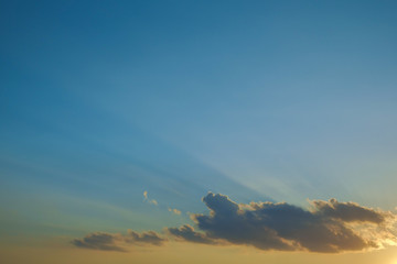 light rays of sun above clear blue sky