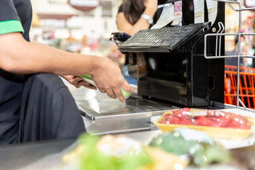 Sales assistant or cashdesk worker in supermarket store