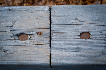 Old wooden surface with metallic nails