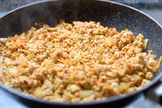 Ground Meat Stir Fry With Onion And Spices In Frying Pan.Selective Focus.