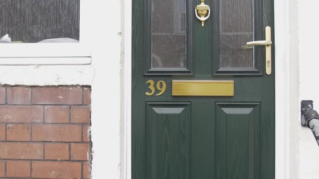 Generic house number on an entrance door.
