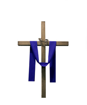Wooden cross draped with purple fabric and thorns