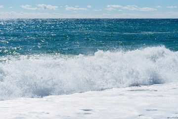 Naklejka na ściany i meble Seascape with waves and clear sky.