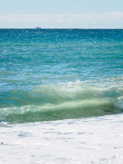 Seascape with waves and clear sky.