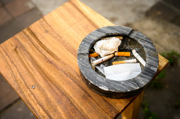 piece tabacco in ashtray on the table
