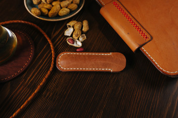 Leather notebook in the bar with beer and nuts on a wooden table, Flat Lay - Powered by Adobe
