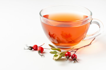 Cup of organic, anti-inflammatory, antimicrobial rosehip tea with berries