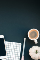 Table with mobile phone and coffee cup