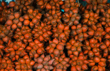 Salak fruit for sale at the market in Thailand. Salacca wallichiana or Salacca zalacca is local traditional Thai fruit, fruit shop in Thailand