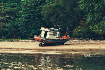 Wooden fishing boat on a sandy beach