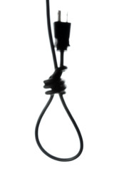 concept of energy dependence: a blurred silhouette of a hinge loop made of an electric cord with a plug, a toning, a haze