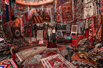 Man and woman in the store. Couple in love in Turkey. Man and woman in the Eastern country. Gift...