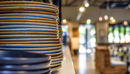 A stack of dinner plates ready for restaurant service