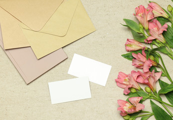 Mockup business card with flowers, notes, envelopes