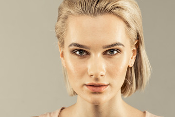 Face of a beautiful pleasant young woman