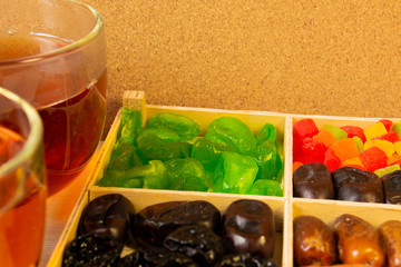 Oriental sweets, dried fruit with a cup of tea