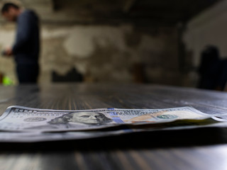 Close up american dollar banknotes. Two hundred dollars bills on the wooden table. new hundred dollar bill