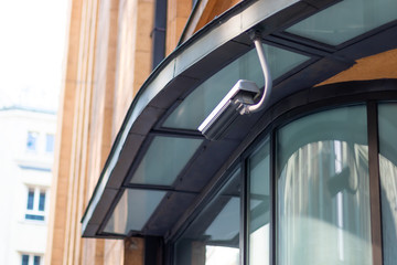 Security Camera on location in a Modern Building video surveillance camera is watching